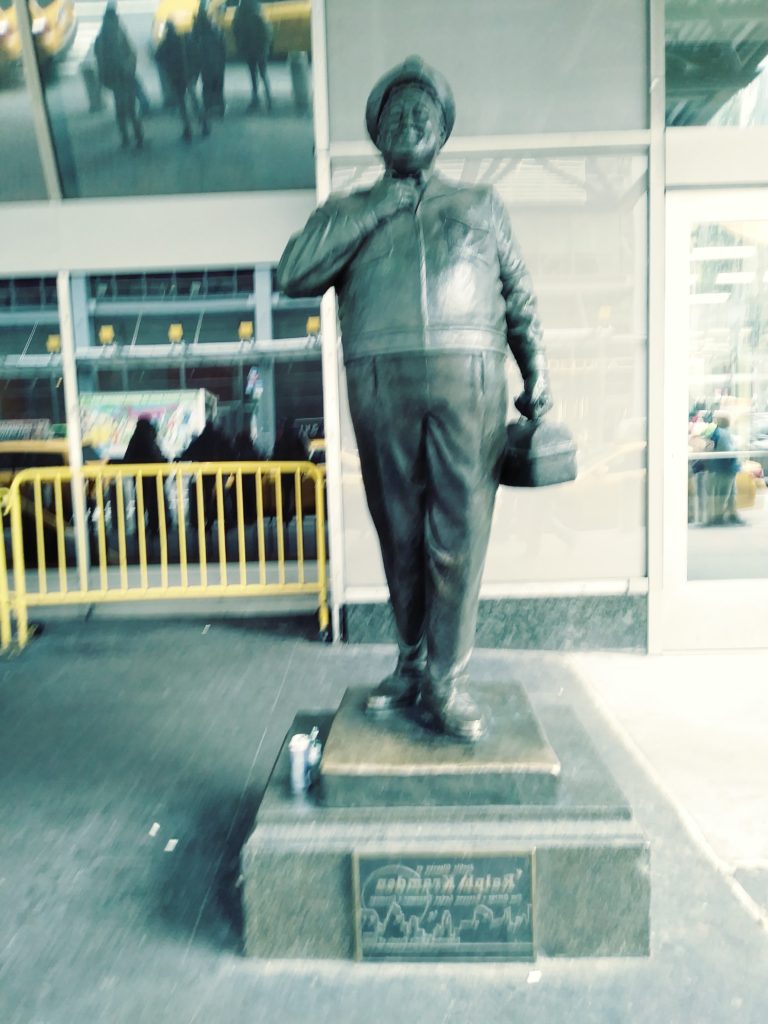 Statue of Ralph Kramden, bus driver, from the tv show, The Honeymooners, stands outside the Port Authority Bus Station.
